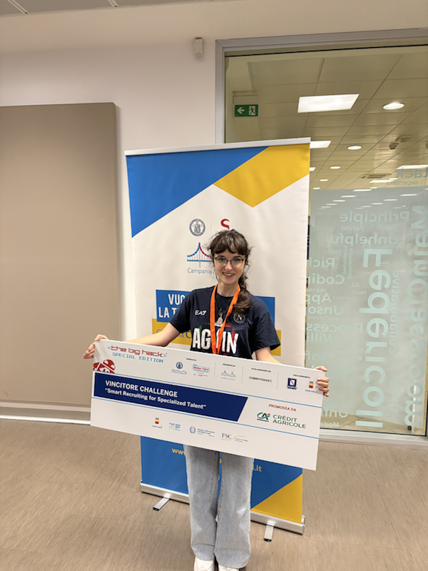 Claudia winning a hackathon challenge